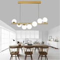 Lampadario a Sospensione Universo A06 – 7 Attacchi G9, Potenza 70W, Colore Oro, 7 Sfere Opache